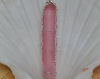 Pink seaglass wrapped in sterling silver wire with sterling silver bead accent.