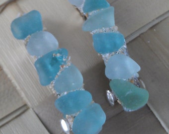 Hair barrettes of Maui seaglass in shades of blue.