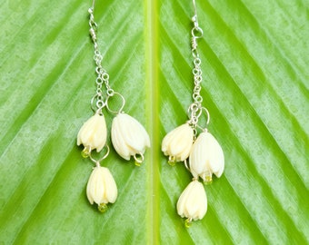 Earrings of carved pikake flowers on sterling silver