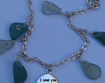 Custom designed anklet of seaglass and silver charm, wrapped in sterling silver wire on sterling chain for a beach wedding day.