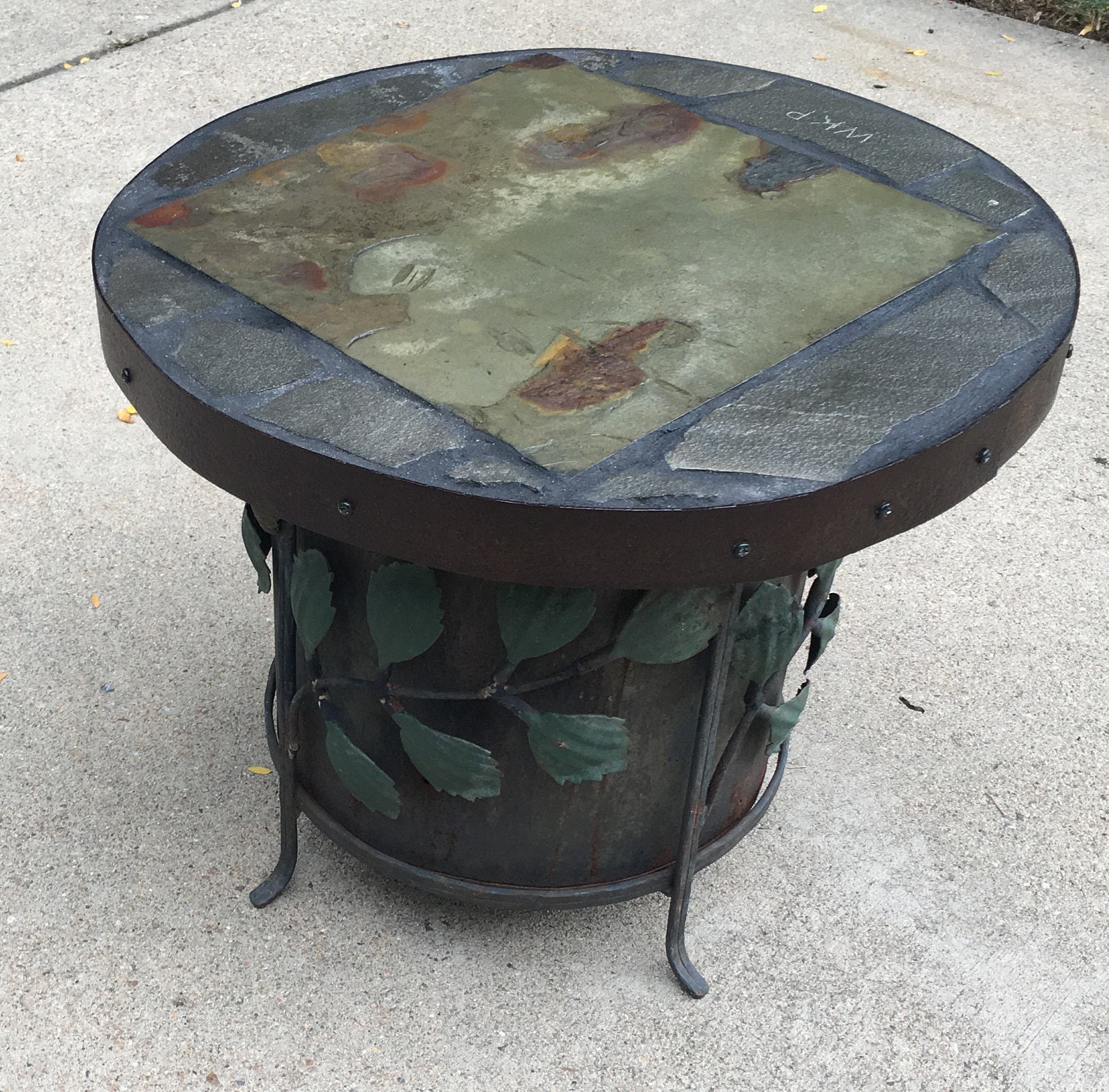 Stash An 18 diameter x 15 tall stone topped folk ark accent table.