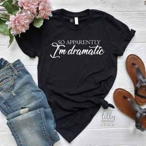 May include: Black t-shirt with white text that reads "So apparently I'm dramatic".