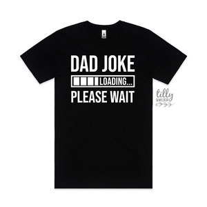 May include: Black t-shirt with white text that reads "DAD JOKE LOADING... PLEASE WAIT".