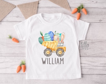May include: A white t-shirt with a yellow toy truck carrying Easter eggs and a bunny rabbit. The truck is filled with colorful eggs and the bunny has long ears. The name "William" is printed below the truck.