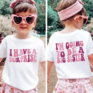 Big Schwester T-Shirt, ich habe eine Überraschung, ich werde ein große Schwester T-Shirt, Vorder- und Rückendesign, Schwangerschaftansage, Big Sis T-Shirt
