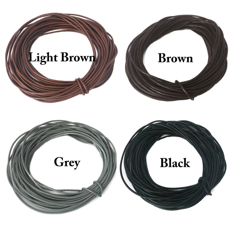 May include: Four spools of leather cord in different colors: light brown, brown, grey, and black. Each spool is labeled with its color.
