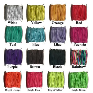 May include: A collection of spools of colorful elastic cord, including white, yellow, orange, red, teal, blue, lilac, fuchsia, purple, brown, black, rainbow, bright orange, bright pink, bright yellow, and bright green.