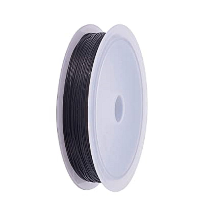 May include: A spool of black jewelry wire, wound around a white plastic bobbin.