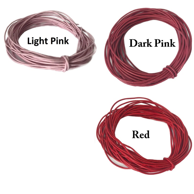 May include: Three spools of leather cord in different shades of pink and red. The spools are labeled "Light Pink", "Dark Pink", and "Red".