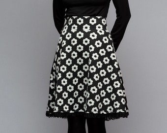 Circle skirt with a high waistband, knee-length, floral, wide-swinging skirt with a floral pattern in black and white