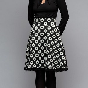 Circle skirt with a high waistband, knee-length, floral, wide-swinging skirt with a floral pattern in black and white