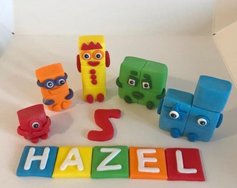 Complete set of 5 Number blocks cake toppers with name and age. Handmade, edible, unofficial. Birthday
