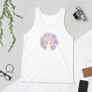 May include: White tank top with a circular design in rainbow colors. The design features the words "smile" and "nothing left to do but smile" arranged in a spiral pattern. A casual, comfortable garment.