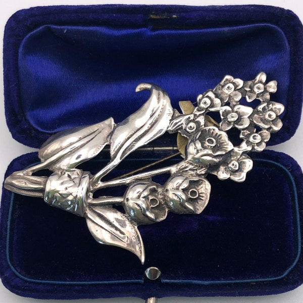 A Vintage Large Sterling Silver brooch of flowers and leaves