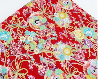 May include: Red fabric with a repeating pattern of gold, white, and blue flowers, stylized birds, and gold ribbons. The background is a red and white wave pattern.