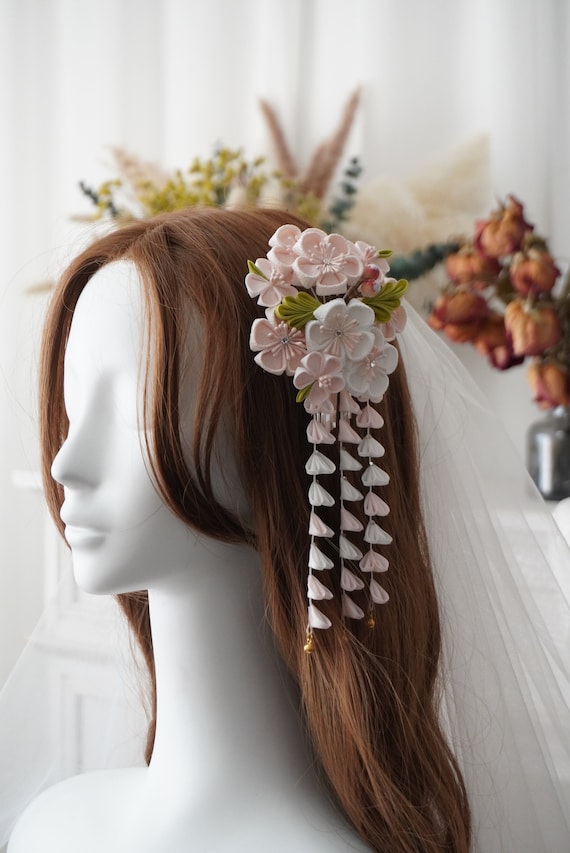 Ornate traditional Japanese hair comb with intricate patterns and precious materials for authentic kimono styling