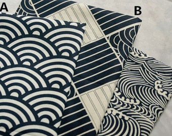 May include: Three fabric swatches with different black and white geometric patterns. The first swatch has a pattern of overlapping semicircles, the second has a pattern of horizontal stripes, and the third has a pattern of stylized waves.