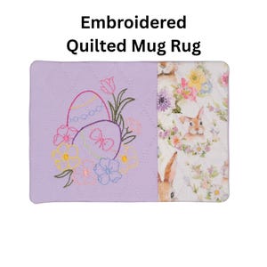 May include: A rectangular quilted mug rug featuring the text Embroidered Quilted Mug Rug. The left side is solid light purple with an embroidered design of two Easter eggs and flowers. The right side has a white fabric with a floral bunny print.