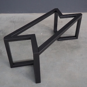 May include: Black metal table base with a geometric design. The base is made of sturdy metal and has a black finish.