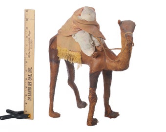 Antique Man on Leather Camel