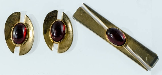 Fermoir à Cravate Vintage Anson - Ton Or Avec Cabochon Rouge - Occasion