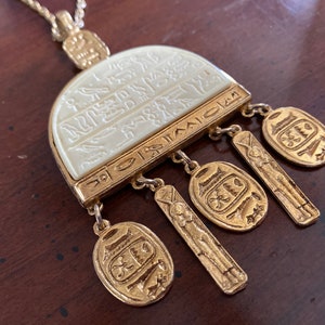 Kenneth Lane Egyptian Revival Gold Carved Lucite Cartouche Pendant Necklace Scarab and Goddess Hathor Dangle - Vintage KJL Necklace