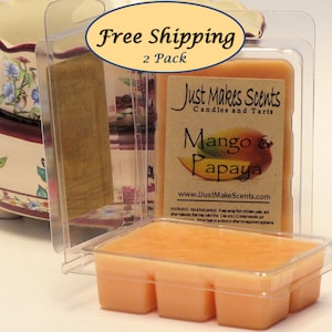 May include: Two-pack of mango and papaya scented wax melts in clear plastic packaging. The packaging has a label that reads "Just Makes Scents Candles and Tarts" and "Mango & Papaya".