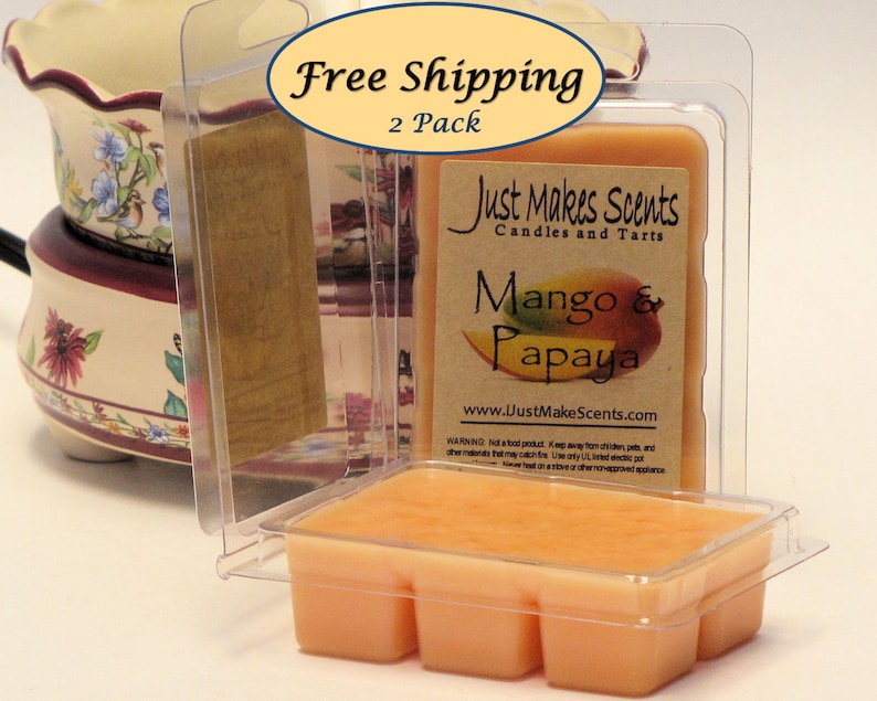 May include: Two-pack of mango and papaya scented wax melts in clear plastic packaging. The packaging has a label that reads "Just Makes Scents Candles and Tarts" and "Mango & Papaya".