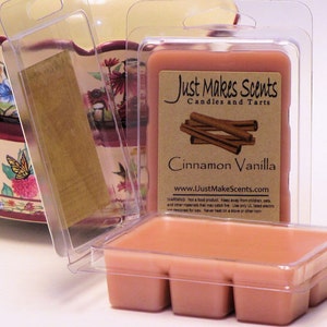 May include: A clear plastic container with a pink wax melt inside. The wax melt is labeled "Cinnamon Vanilla" and is from the company "Just Makes Scents Candles and Tarts".