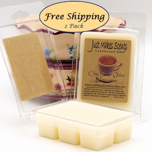May include: Two-pack of wax melts in clear plastic packaging. The wax melts are white and have a label that reads "Just Makes Scents Candles and Gifts" and "Chai Latte Odor Eliminator".