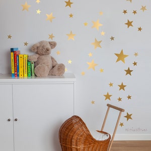 Gold Star Vinyls. Decoration with decorative vinyl gold stars. Wall Stickers Golden Stars Decoration. Glitter gold image 1