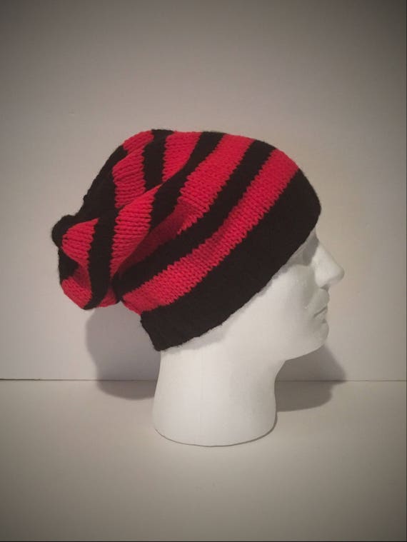 red and black bobble hat