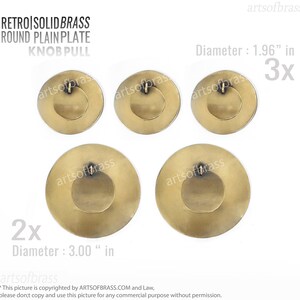 May include: Five solid brass round cabinet knobs with a plain plate design. Three knobs are 1.96 inches in diameter and two knobs are 3.00 inches in diameter.