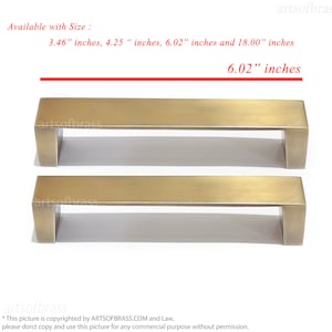 May include: Two gold-toned metal cabinet pulls, each with a rectangular shape and rounded edges. The pulls are 6.02 inches long. Available sizes are 3.46 inches, 4.25 inches, 6.02 inches, and 18.00 inches.