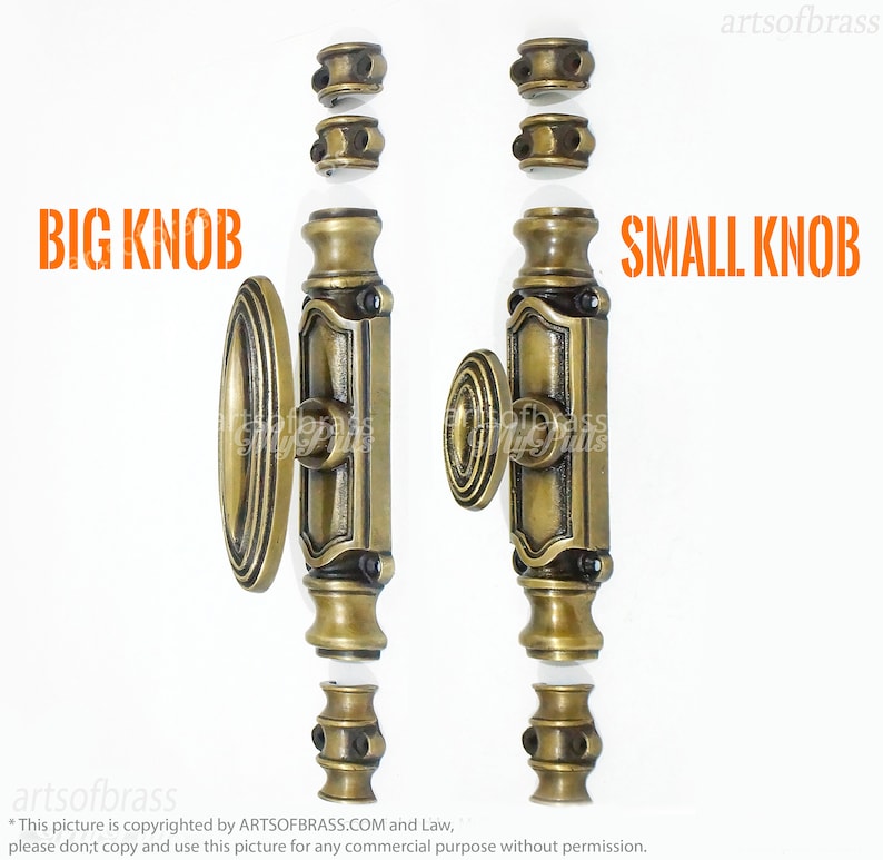 May include: Two antique brass door latch sets with different sized knobs. The set on the left has a larger oval knob and the set on the right has a smaller round knob. Both sets have a decorative plate with a floral design and a square shape.