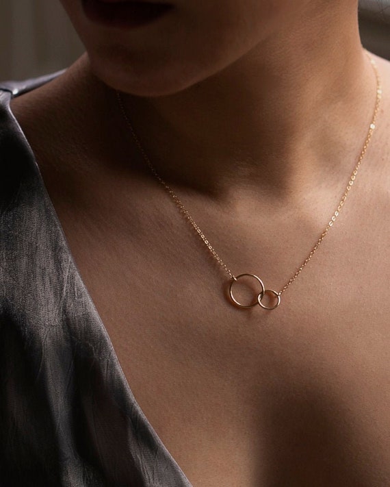 Linked ring necklace discount