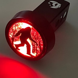 Bigfoot in the Woods Round LED Hitch Cover - Brake Light