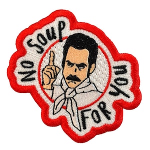 May include: A red and white embroidered patch with a cartoon character saying "No soup for you".