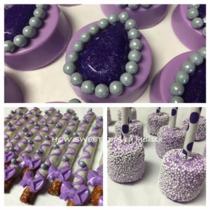 May include: Purple and silver themed party favors, including chocolate-covered pretzels with purple bows and silver sprinkles, chocolate-covered Oreos with a purple and silver design, and marshmallow pops with purple and silver sprinkles.
