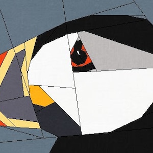 Puede incluir: Una ilustraci&oacute;n geom&eacute;trica de la cabeza de un frailecillo con un esquema de color negro, blanco, naranja y amarillo. El ojo del frailecillo es rojo.