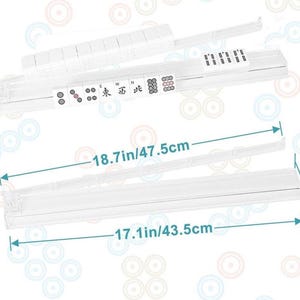 May include: Clear plastic Mahjong tile holders, with dimensions of 18.7 inches/47.5cm long, 17.1 inches/43.5cm wide, and 2.12 inches/5.4cm high. The holders are designed to organize Mahjong tiles, with visible tiles and Chinese characters.