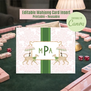 May include: A printable and reusable Mahjong card insert with a floral background and green vertical stripes. The card features a gold frame with the initials "MPA" and illustrations of leopards under parasols. Mahjong tiles and dice are visible.