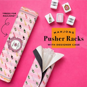 May include: Pink and white striped Mahjong pusher rack case with champagne bottle pattern. The case is open, revealing clear plastic pusher racks. The image also shows Mahjong tiles and the text "PRESS FOR MAHJONG".