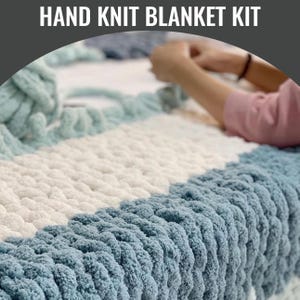 May include: A hand knit blanket kit with the text "HAND KNIT BLANKET KIT" at the top. The blanket is a mix of white, light blue, and teal colors. The blanket is being hand knit with thick yarn. The person's hands are visible.