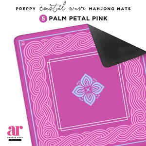 May include: A Palm Petal Pink Mahjong mat with a coastal wave design. The mat features a central square with a light blue floral design and a white border. The edges have a repeating wave pattern in pink and light blue. The text "PREPPY coastal wave MAHJONG MATS" is at the top.