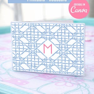 May include: A white card insert with a blue geometric pattern and a pink letter "M" in the center. Text at the top reads "Editable Mahjong Card Insert Printable • Reusable". A pink circle says "Editable in Canva".