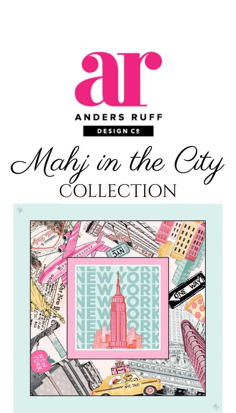 May include: A colorful illustration featuring the text "Mahj in the City COLLECTION" and the Anders Ruff Design Co. logo. The artwork depicts iconic New York City landmarks, including the Empire State Building, a yellow taxi, and a pink airplane.