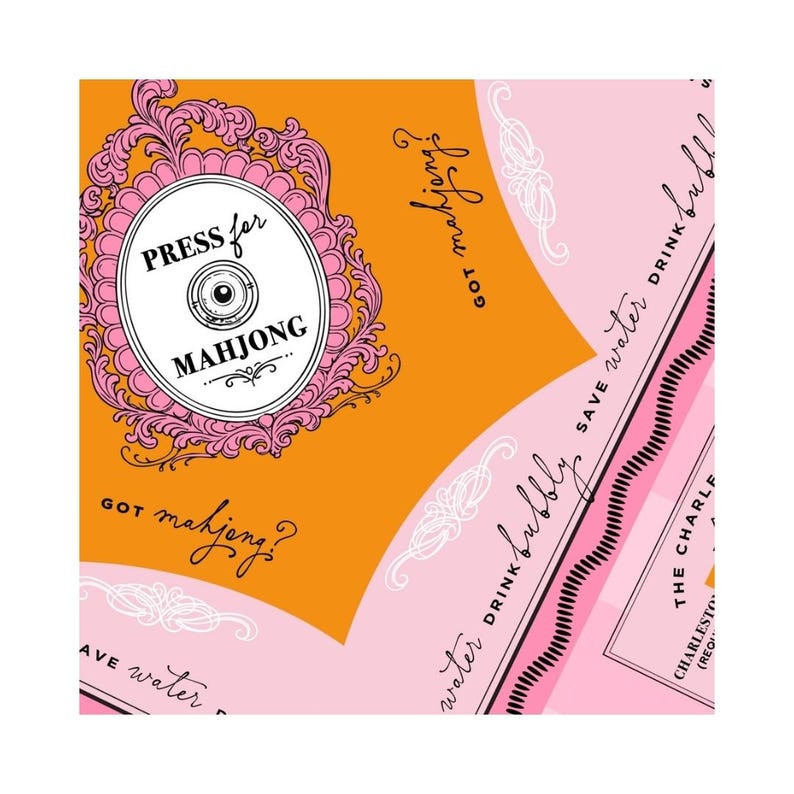 May include: A colorful graphic design with the text "PRESS for MAHJONG" inside a pink and white oval frame. The design features orange and pink sections with the phrases "Got mahjong?" and "Save water drink bubbly".