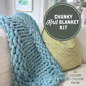 May include: A light blue chunky knit blanket is draped over a beige sofa. A green cushion with a geometric pattern is next to it. The image includes text that reads "Chunky Knit Blanket Kit" and "20 Colors to Choose From."