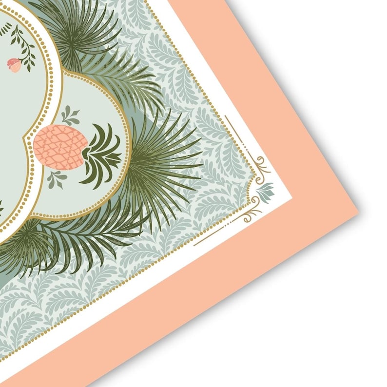 May include: A decorative print featuring a light blue background with a repeating floral pattern. The design includes a gold-bordered oval with a pink pineapple and green palm fronds. The print is framed with a peach-colored border.